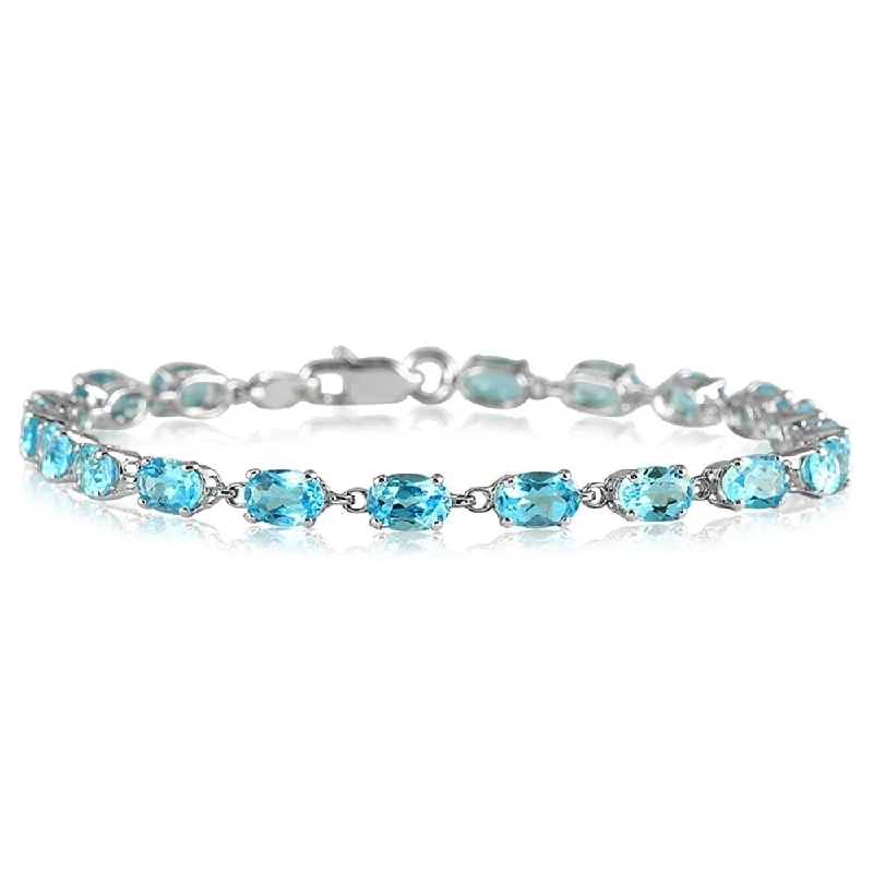 women custom bracelets -Marquee 10 1/2 Carat Oval Blue Topaz Bracelet in 10K White Gold